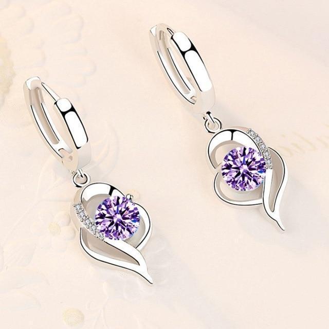Boucles d'oreilles argentées avec fleurs incrustées de zircones cubiques