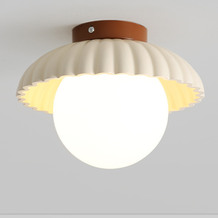 Ceiling lamp with a frosted shade providing warm lighting in the hallway
