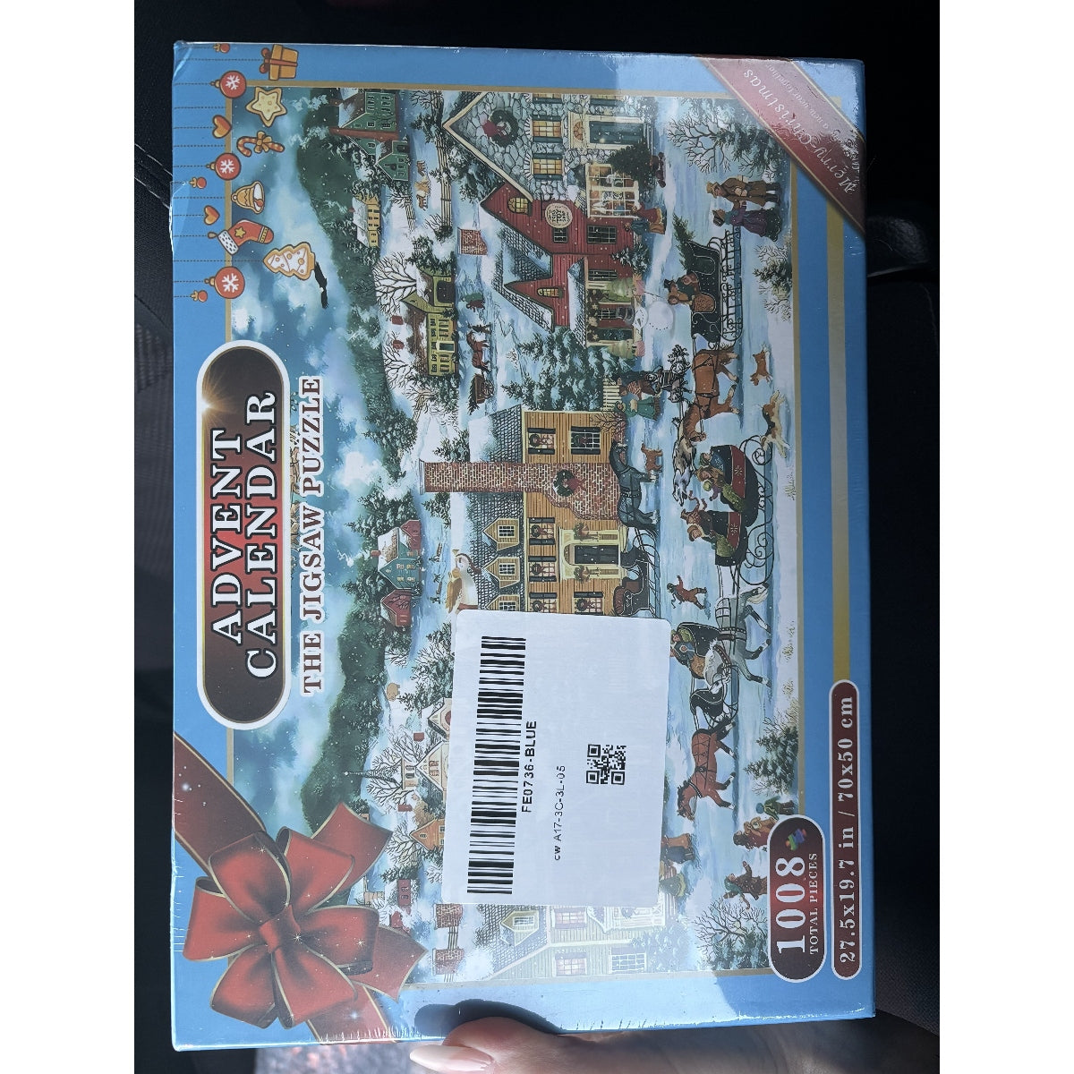 Calendrier de l'Avent sous forme de puzzle représentant un village de Noël moderne