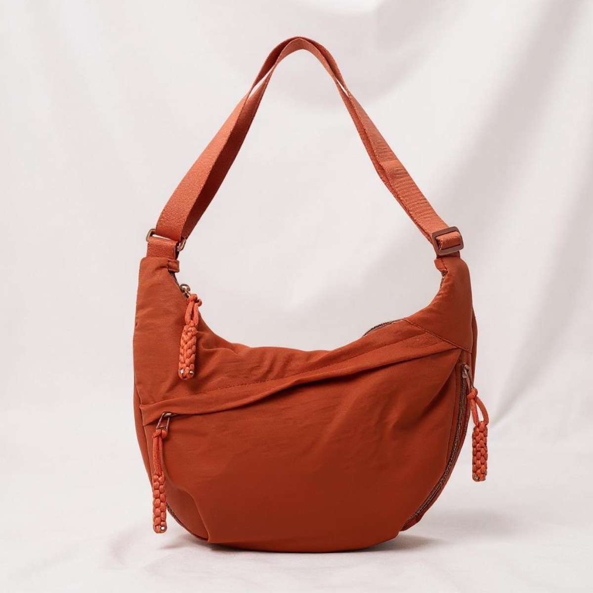 Sac bandoulière orange en demi-lune