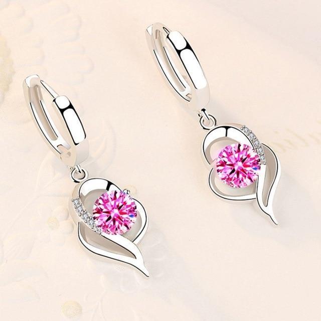 Boucles d'oreilles argentées avec fleurs incrustées de zircones cubiques