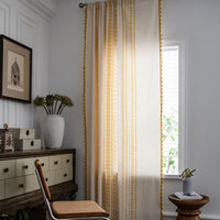 Cortina artesanal con borlas Solstice Loom